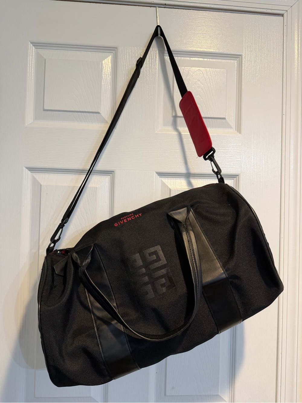 Givenchy Parfums Black Duffel Bag with Red Shoulder Pad